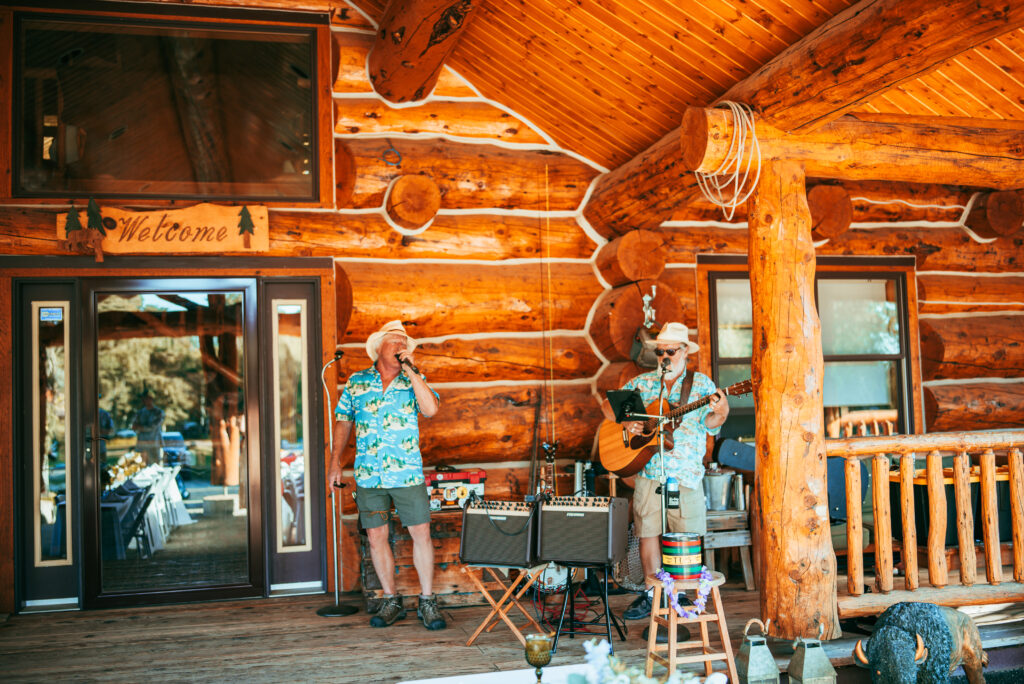 Live music on the log cabin porch at sunset