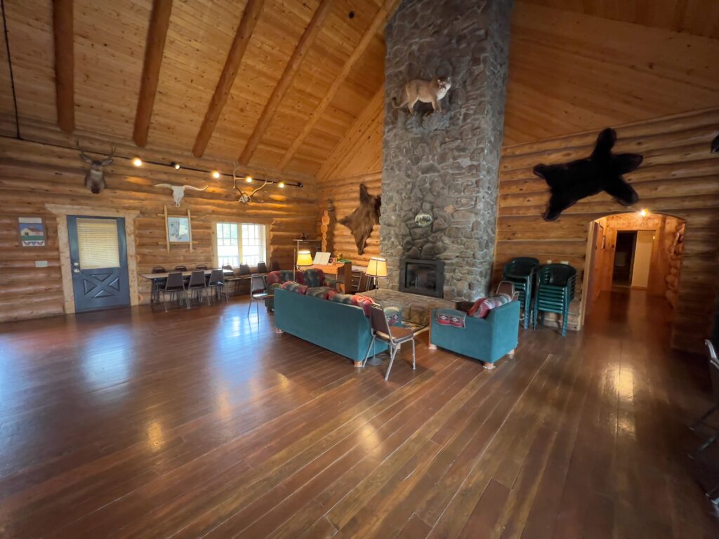 Great room with hand-scribed log construction and lodge furnishings