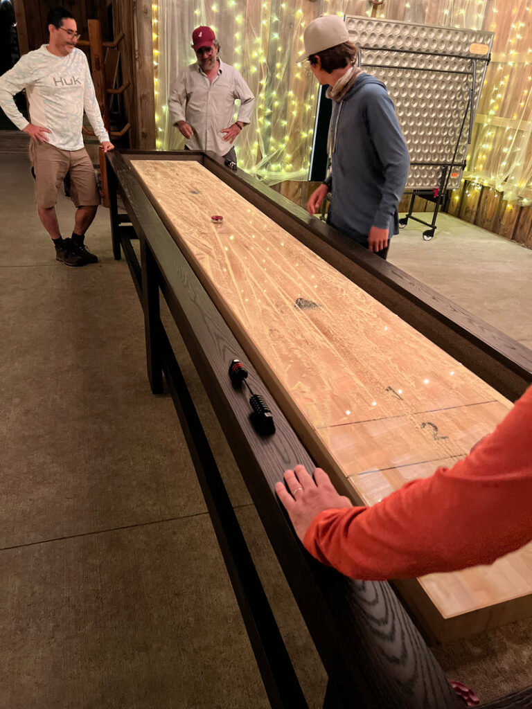 Guests playing shuffleboard at the lodge