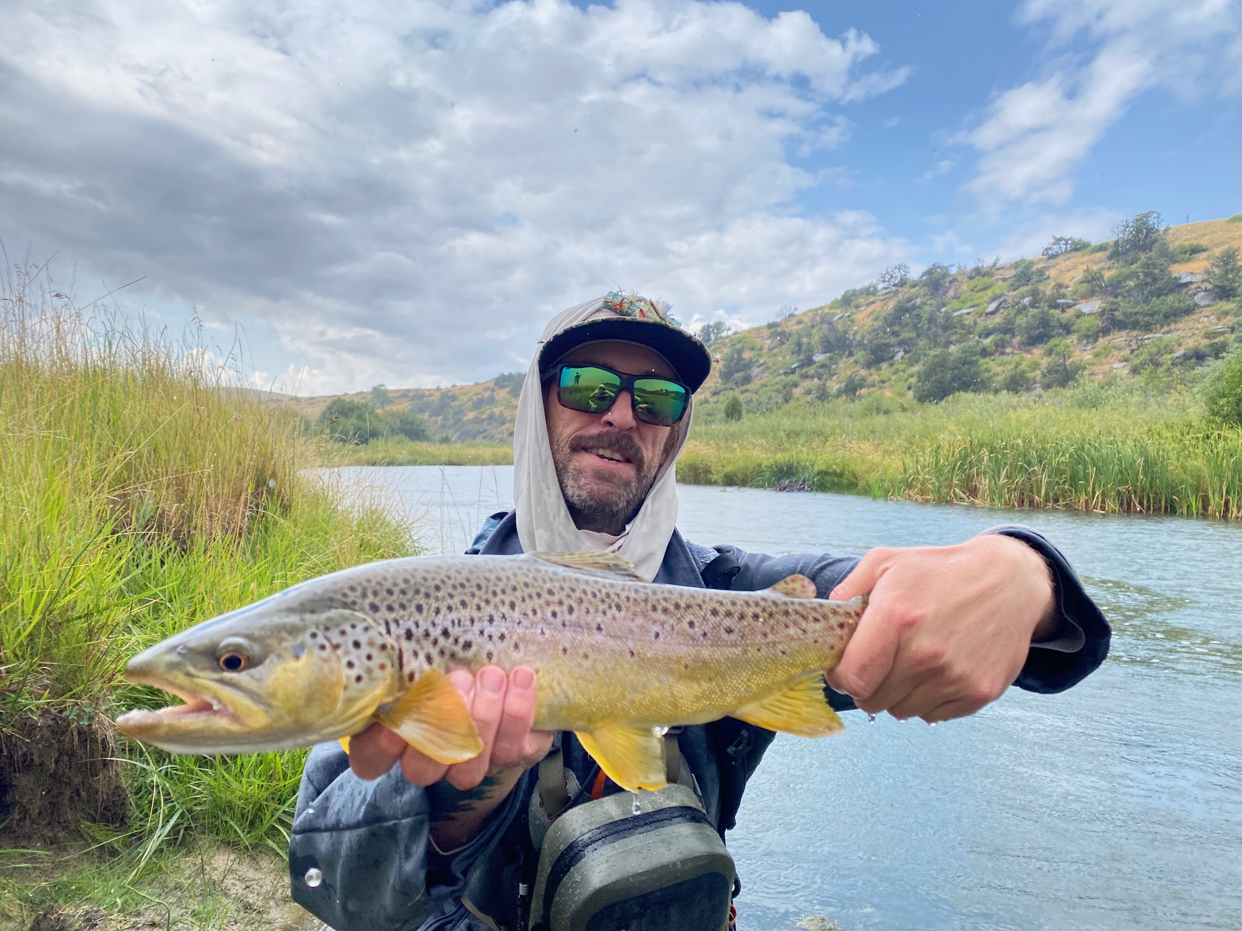 Guide Brandon Coletti with a hefty brown trout