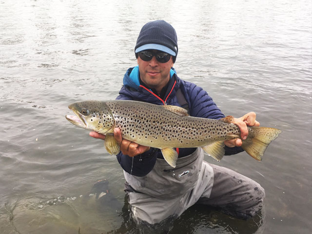 Guide Chad Pavlic with a trophy brown trout