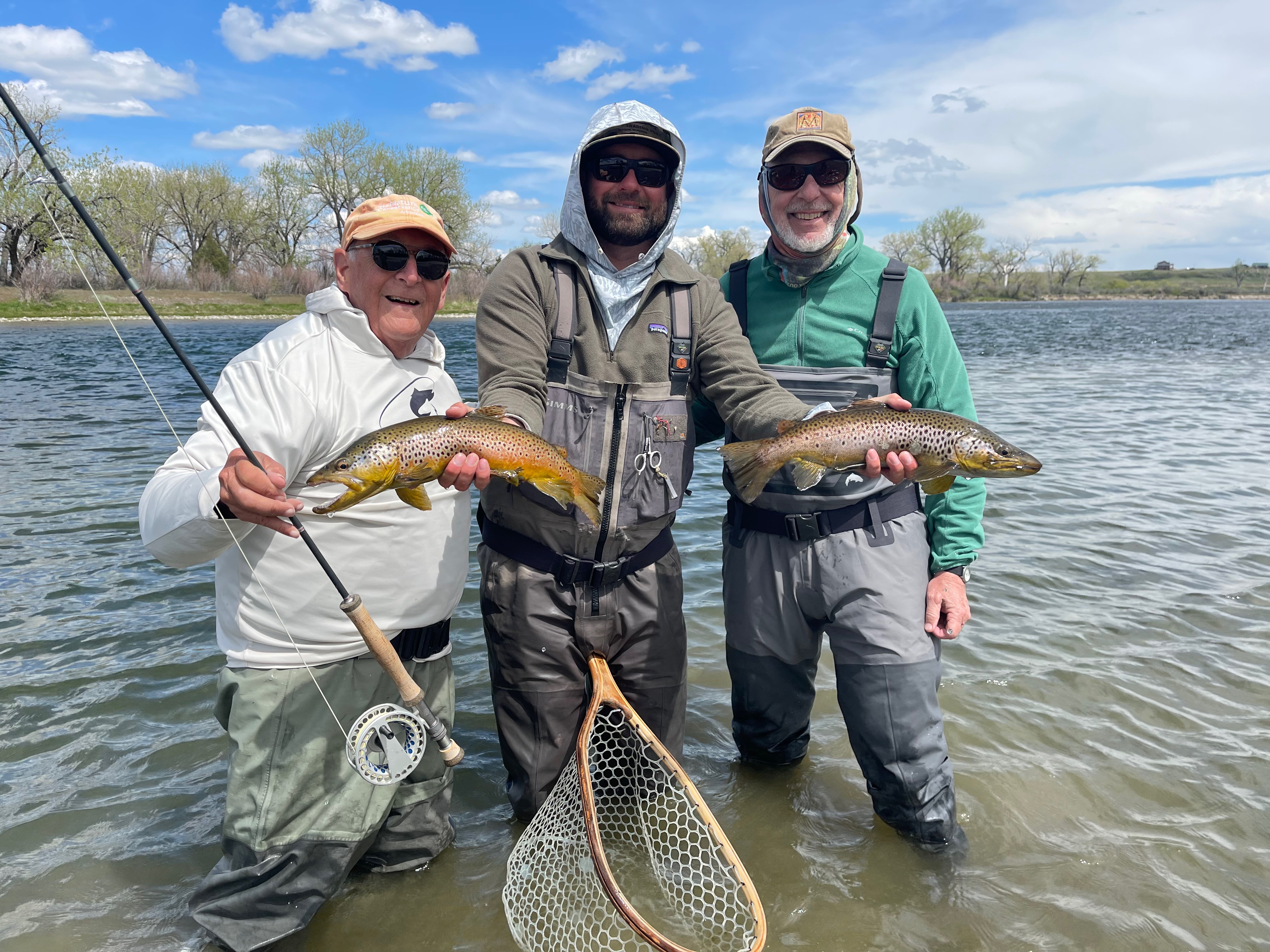 Guide Ryan Stefik with guests and double brown trout catch