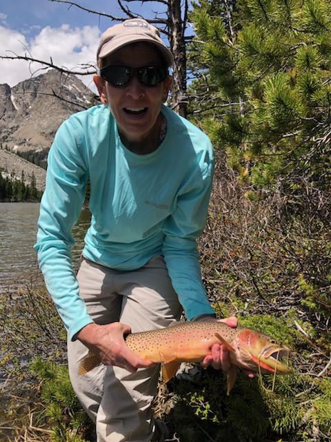 Guide Liz Foley with a golden cutthroat trout