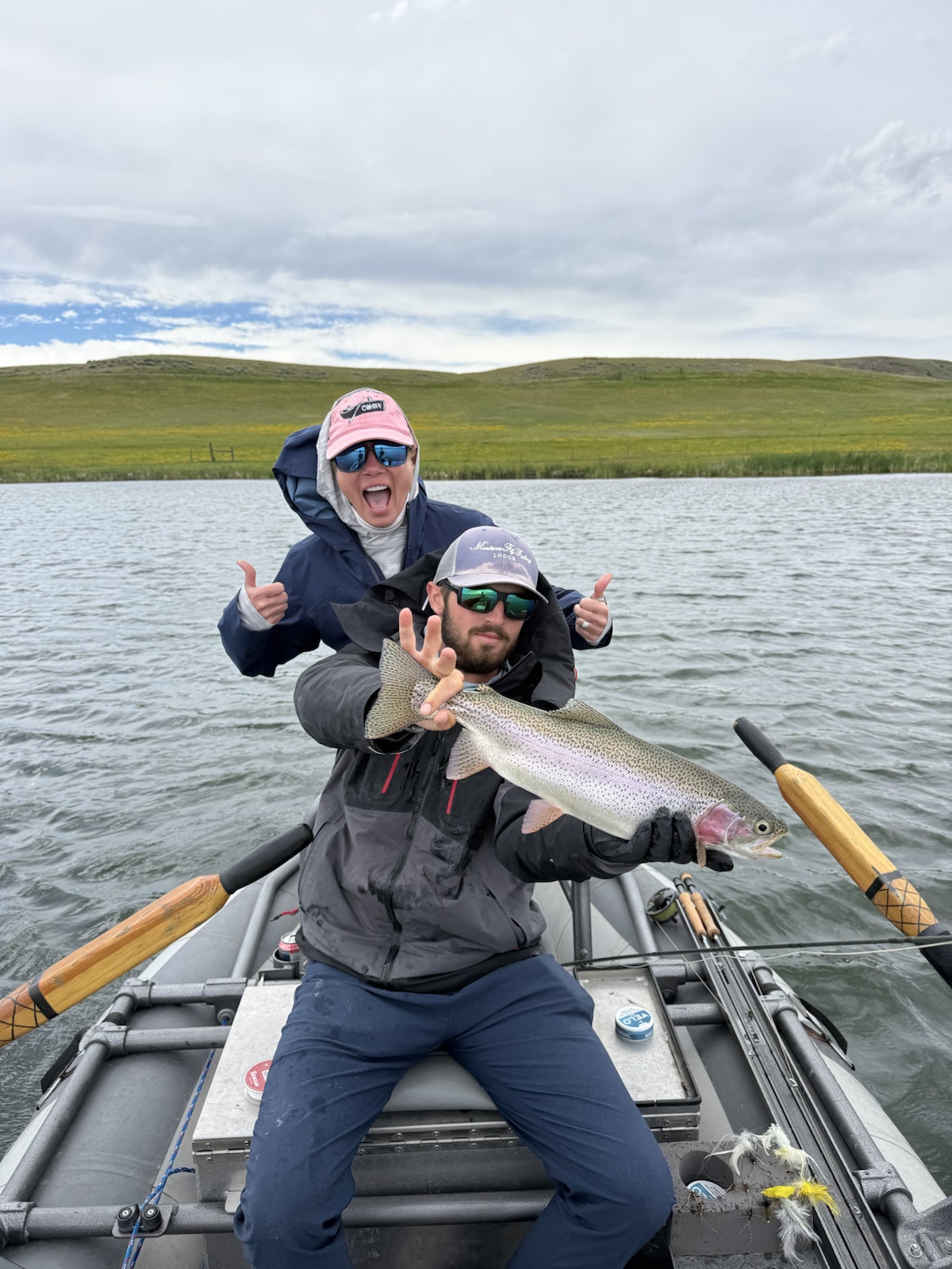 Guide Alex Hepworth with a guest and a brown trout