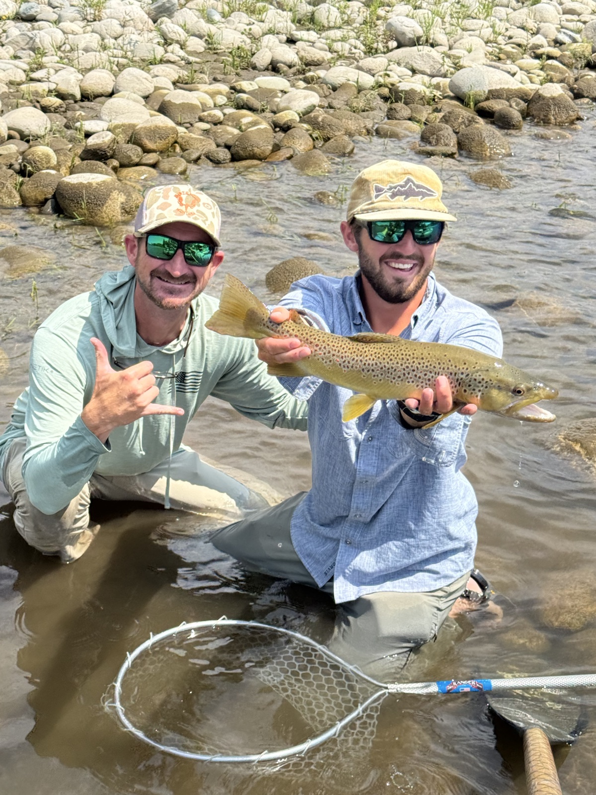 Guide Alex Hepworth with a guest's brown trout