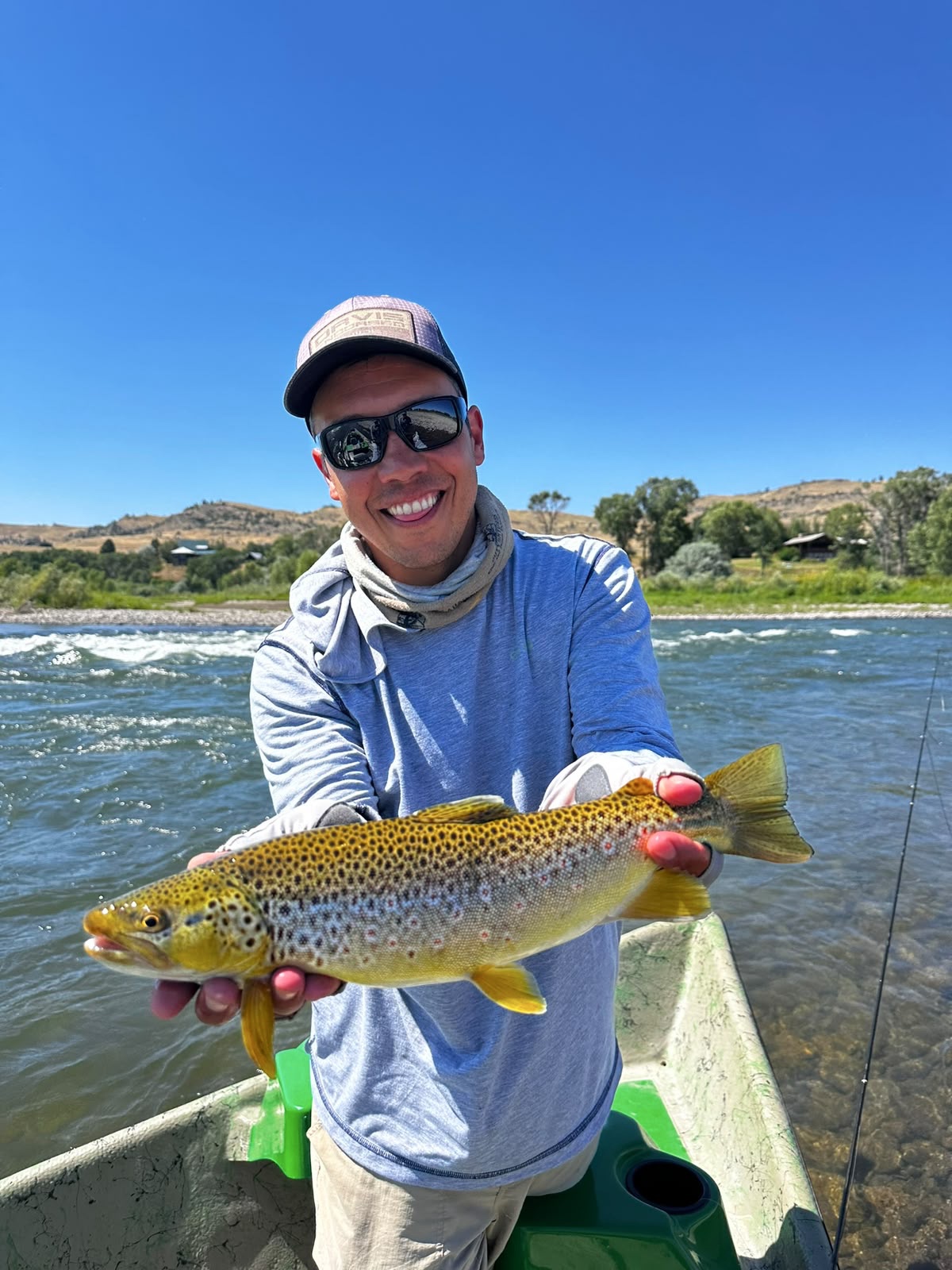 Guide Pablo Manavella releasing a brown trout