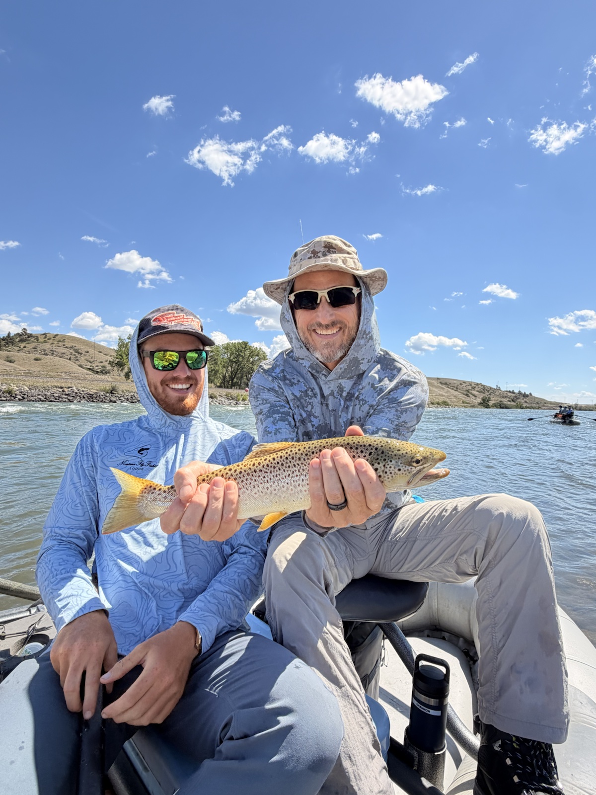 Guide Sean McLendon with a guest and a brown trout
