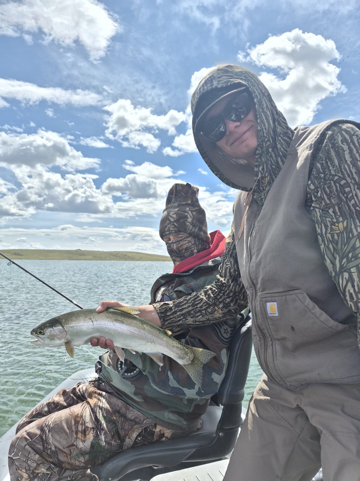 Guide Chase Glowacki with a guest and a trout