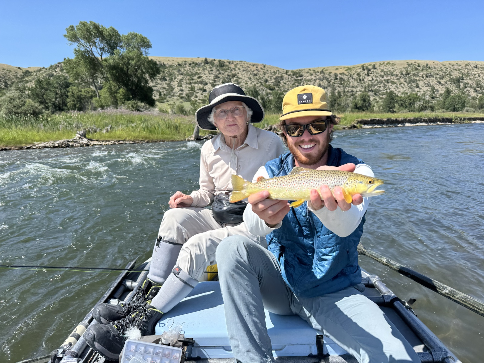 Guide Sean McLendon with a guest and a brown trout