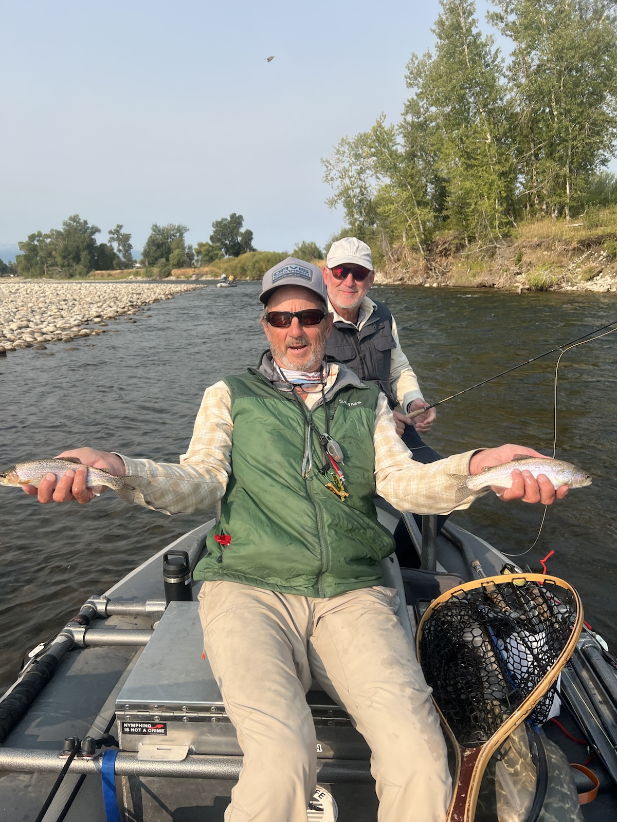 Guide Greg Swoboda with guests and a double catch on the river