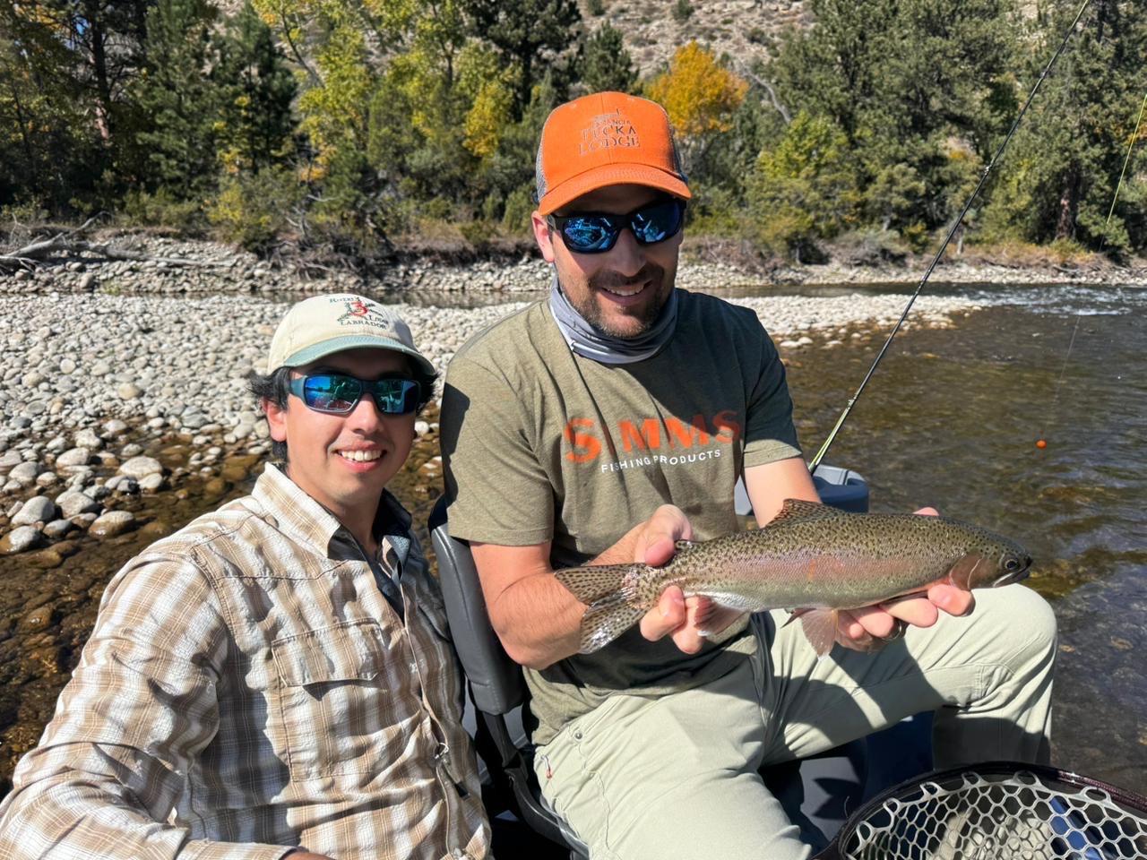Guide Juan Shanahan with a guest and a rainbow trout