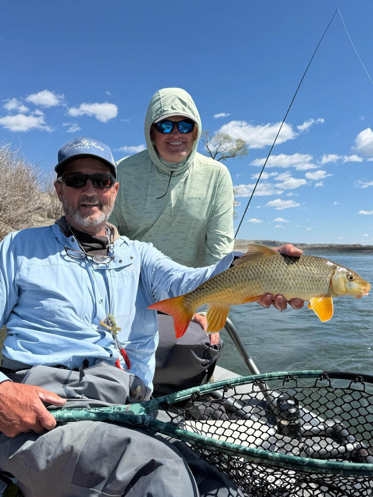 Guide Greg Swoboda with a guest's golden trout catch