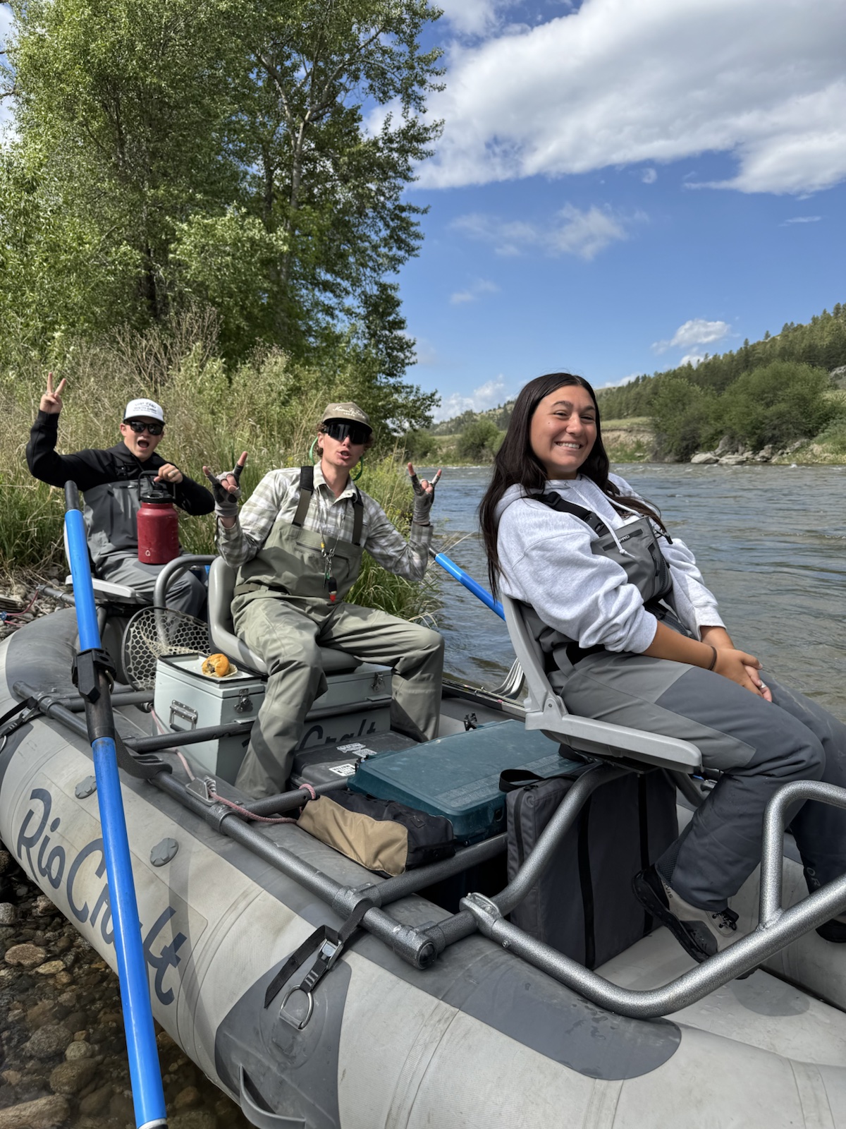 Guide Keenan Morrison with guests on the raft