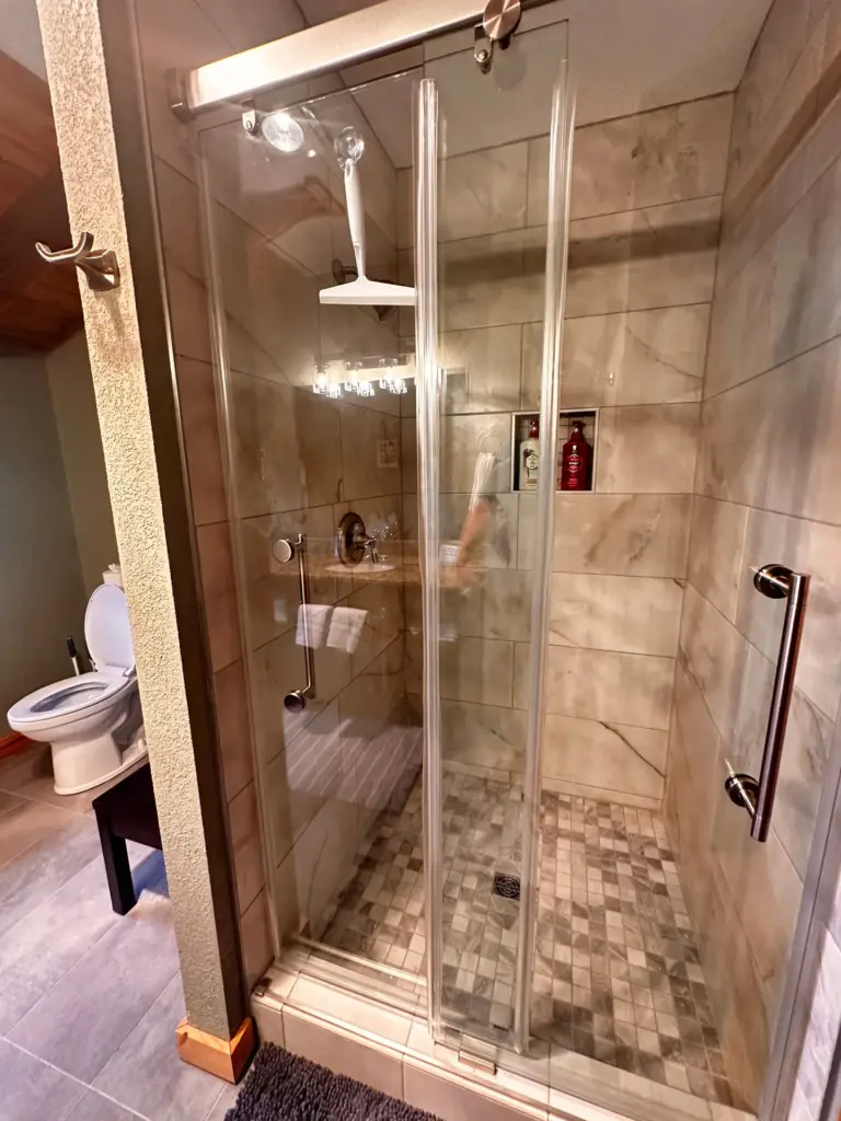 Tiled walk-in shower and bathroom