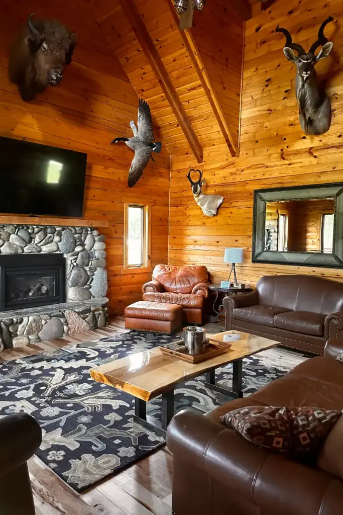 The Great Room with stone fireplace and lodge furnishings