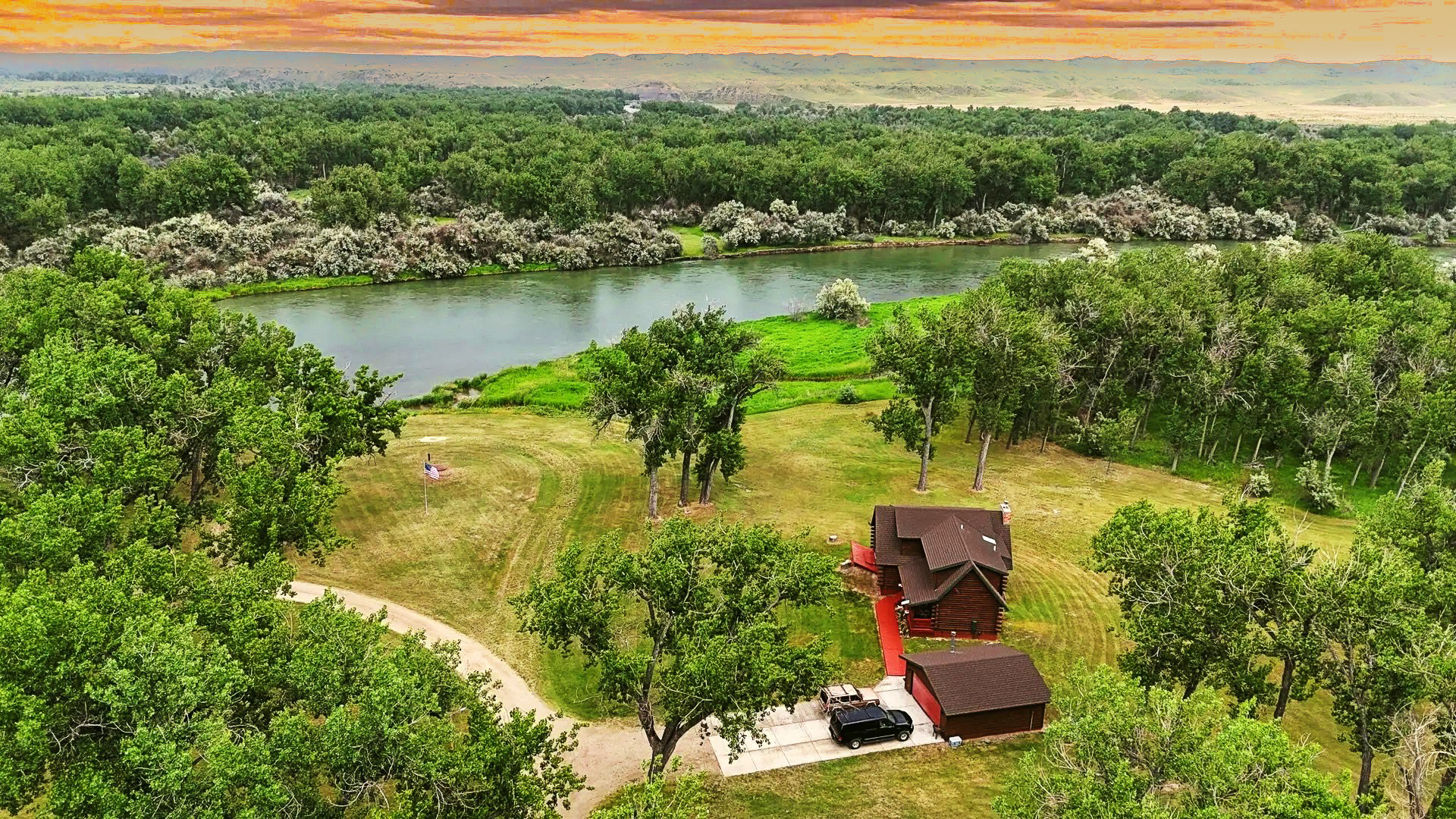 Aerial view of Bighorn River Fly Fishing Lodge on the Bighorn River at sunset